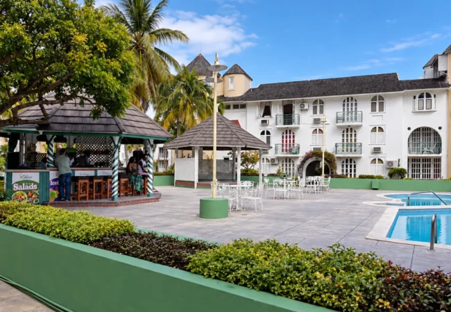 Exterior view of Almond Grove at Sand Castle resort grounds and oceanfront suites in Ocho Rios Jamaica