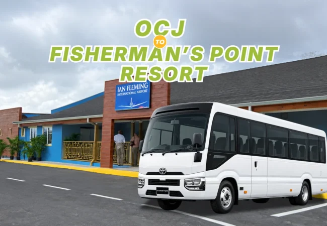 White Toyota Coaster bus parked at Ian Fleming International Airport terminal for transfer to Fisherman’s Point Resort.