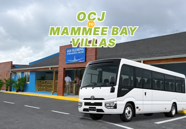 Air-conditioned white Toyota Coaster passenger bus ready at Ian Fleming International Airport terminal for private transport to Mammee Bay Estates.